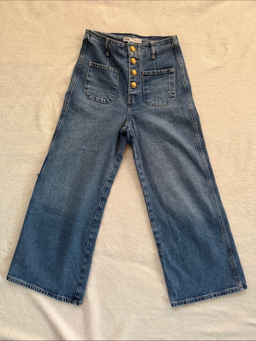 Zara Wide Leg High-Rise Jeans with Front Patch Pockets and gold buttons front